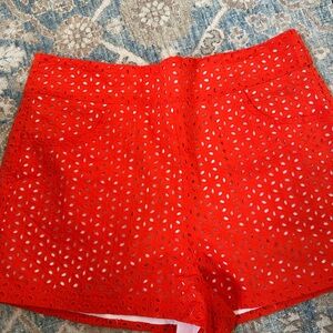 Woman’s orange eyelet shorts
